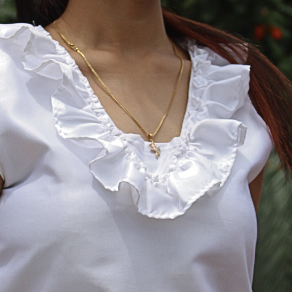 white ruffled neckline top